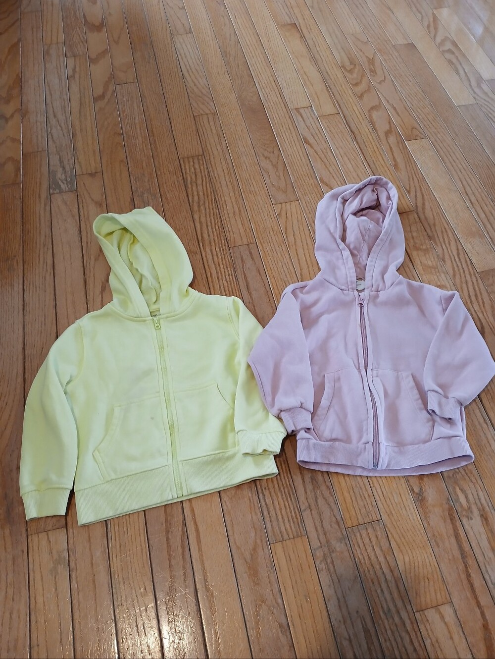 Two Zip Up Hooded Sweaters One Pink And One Yellow